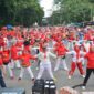 Suasana senam jantung massal di Pelataran Parkir Selatan GOR H. Agus Salim Padang. (Prokopim Padang)