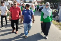 Camat Nanggalo Amrizal Rengganis mengikuti jalan santai STIFARM, Sabtu (27/7).