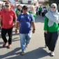 Camat Nanggalo Amrizal Rengganis mengikuti jalan santai STIFARM, Sabtu (27/7).