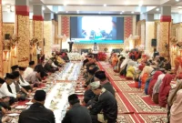 Pj Sekdako Padanmemberikan sambutan saat acara makan bajamba FABN di Gedung Youth Center Padang, Kamis (9/5/2024). 