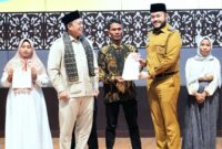 Wali Kota Padang Fadly Amran menghadiri Sosialisasi Pengadministrasian dan Pendaftaran Tanah Ulayat yang digelar Kementerian ATR/BPN di Auditorium UNP, Senin (28/4/2025). (Foto: Prokopim Padang)