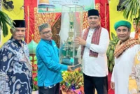Camat Lubeg Nofiandi Amir membuka Pekan Muharram Tahun 1447 H di Surau Koto Panjang Kelurahan Batuang Taba Nan XX, Jumat (18/7/2025). (Foto: Ist)