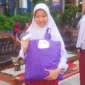 Syafira Ichwansyah Putri, salah satu penerima Kartu Padang Juara di SMPN 2 Padang. (Foto: Diskominfo Padang)