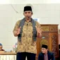 Camat Lubeg Nofiandi Amir memberikan sambutan saat menghadiri Peringatan 1 Muharram 1447 H di Masjid Nurul Iman Buah Patai, Kelurahan Batuang Taba Nan XX, Rabu (23/7/2025). (Foto: Ist)