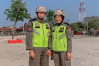 Dua atlet Satpol PP Padang, Nico dan Suci, siap bertanding di PON Bela Diri 2025. (Foto: Humas Satpol PP Padang)