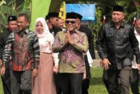 Bupati Pasbar Yulianto menghadiri tasyakuran penerimaan warga baru PSHT Ranting Kinali, Kecamatan Kinali, Minggu (24/8/2025). (Foto: Diskominfo Pasbar)