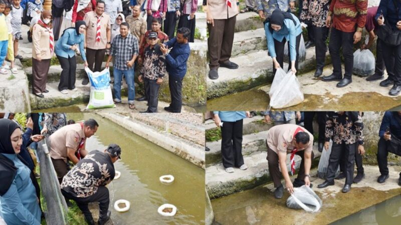 Wali Kota Pariaman, Yota Balad bersama Anggota DPR RI Komisi IV, Cindy Monica Salsabila Setiawan menebarkan 20 ribu benih ikan mas dan ikan nila di dua lokasi di Kecamatan Pariaman Tengah, Kamis (21/8/2025). (Foto: Kominfo Pariaman)
