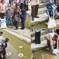 Wali Kota Pariaman, Yota Balad bersama Anggota DPR RI Komisi IV, Cindy Monica Salsabila Setiawan menebarkan 20 ribu benih ikan mas dan ikan nila di dua lokasi di Kecamatan Pariaman Tengah, Kamis (21/8/2025). (Foto: Kominfo Pariaman)