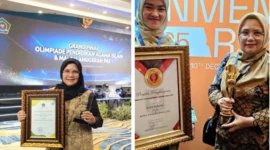 Staf Ahli Wali Kota Bidang Kemasyarakatan dan Sumber Daya Manusia, dr. Feri Mulyani saat menerima penghargaan. (Foto: Diskominfo Padang)