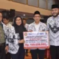 Pemko Padang menerima donasi tanggap bencana dari PB PGRI di Hotel Truntum Padang, Sabtu malam (17/1/2026). (Foto: Prokopim Padang)