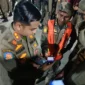 Satpol PP Padang kini memiliki aplikasi “Satpol PP Mobile” untuk pengawasan personel secara real time, memperkuat kinerja dan pelayanan publik. (Foto: Humas Satpol PP Padang)