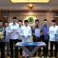 Menag Nasaruddin Umar dan Wakil Ketua Umum Dewan Pimpinan MUI, K.H. Marsudi Syuhud bersama Pejabat dan Pimpinan Kemenag dan MUI dalam giat penandatanganan MoU mengenai Implementasi KUHP dan KUHAP. (Foto: Firmandan Wijaya/Kemenag)