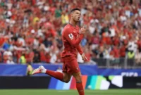 Cristiano Ronaldo melakukan selebrasi usai mencetak gol ke gawang Uzbekistan. (Foto: FIFA.com)