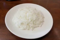 Ilustrasi nasi. (Foto: AI Generate)