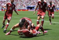 Pemain Qatar merayakan gol usai membobol gawang Swiss dalam laga Grup B di Stadion San Francisco Bay Area, Minggu (14/6) pagi WIB. (Foto: FIFA.com)