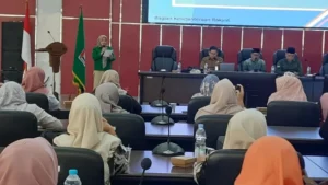 Ketua Panitia FGD Ernita menyampaikan laporan kegiatan