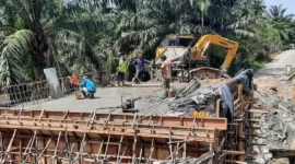 Salah satu pembangunan infrastruktur di Kabupaten Dharmasraya. (Foto: Diskominfo Dharmasraya)