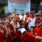 Wali Kota Padang Fadly Amran saat menghadiri Jalan Santai se-Kelurahan Kubu Dalam Parak Karakah di Lapangan RW 05, Kecamatan Padang Timur, Minggu (23/8/2026). (Foto: Pemko Padang)