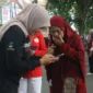 Dinsos Padang menggencarkan sosialisasi Portal Perlinsos di kawasan CFD, tepatnya di depan Kantor Disnakerin  Padang, Minggu (16/8/2026). (Foto: Pemko Padang)