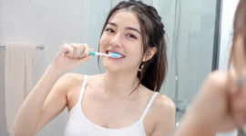 Ilustrasi wanita menggosok gigi. (Foto: AI Generate)