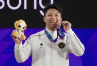 Rahmat Erwin Abdullah mempersembahkan medali emas kedua Indonesia pada nomor 75 kg putra cabang olahraga angkat besi. (Foto: Dok. NOC/NMA)