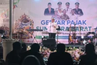 Ketua DPRD Sumbar Muhidi saat menghadiri kegiatan Gebyar Pajak. (Foto: Ist)