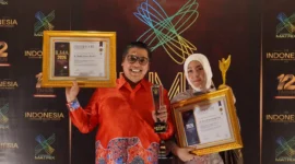 Wali Kota Padang Panjang Hendri Arnis dan Ketua TP-PKK Maria Feronika Hendri meraih penghargaan ILMA 2026 di Bali. (Diskominfo Padang Panjang)
