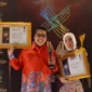 Wali Kota Padang Panjang Hendri Arnis dan Ketua TP-PKK Maria Feronika Hendri meraih penghargaan ILMA 2026 di Bali. (Diskominfo Padang Panjang)